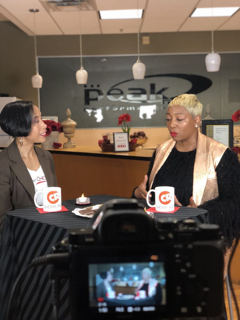 Two woman sitting and going on with a interview